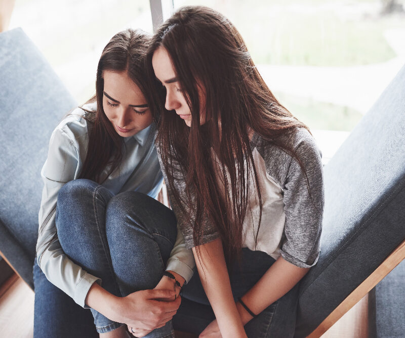 Two girls contemplating getting treatment for depression at aspen view mental health in greeley, colorado.