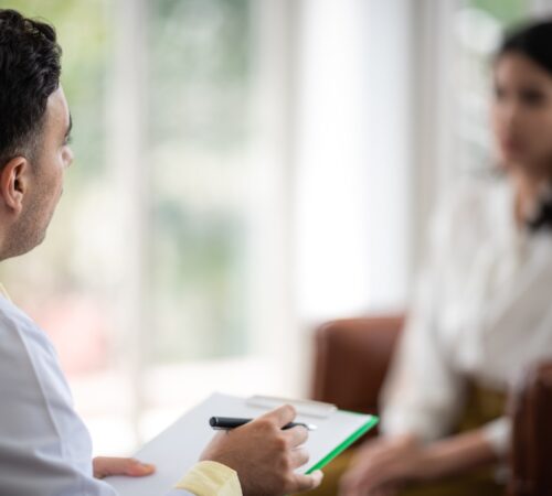 Mental health concept, Close-up of psychologist comforting his depressed patient, Doctor (psychiatrist) consultation and diagnostic examining woman patient