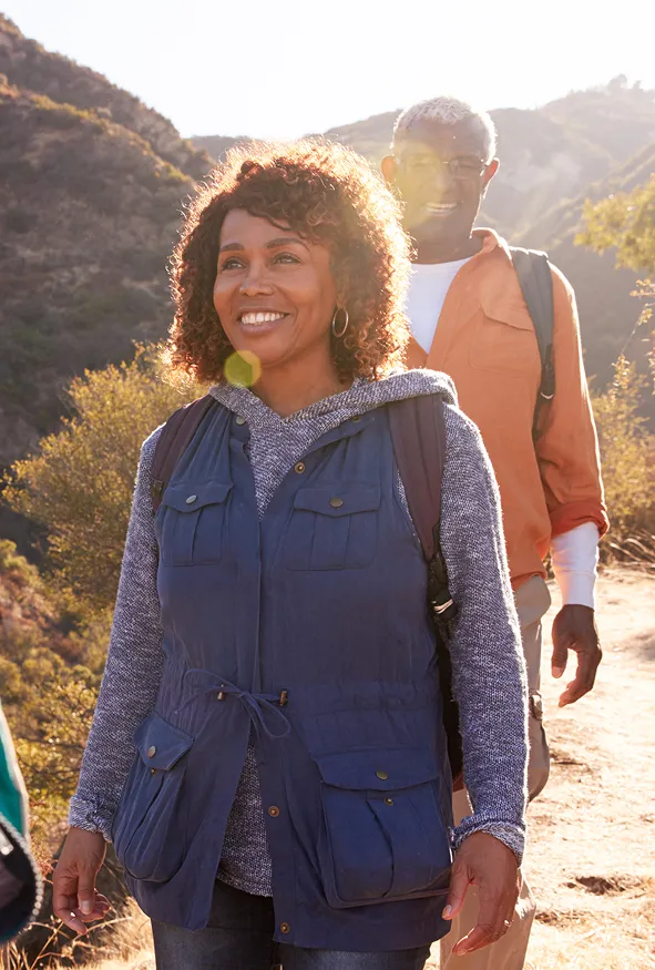 woman with curly hair on a hike getting mental health treatment in greeley, colorado.