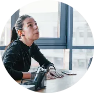 A woman in pony tail at work in need of mental health treatment in greeley, colorado.
