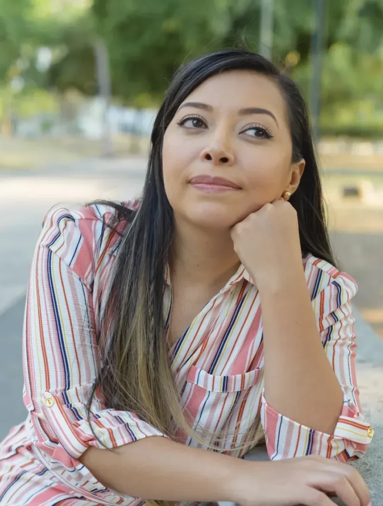 woman in striped shirt searching for bipolar treatment centers colorado