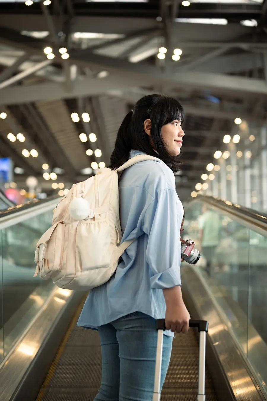 Aspen View Mental Health - happy young woman traveler standing