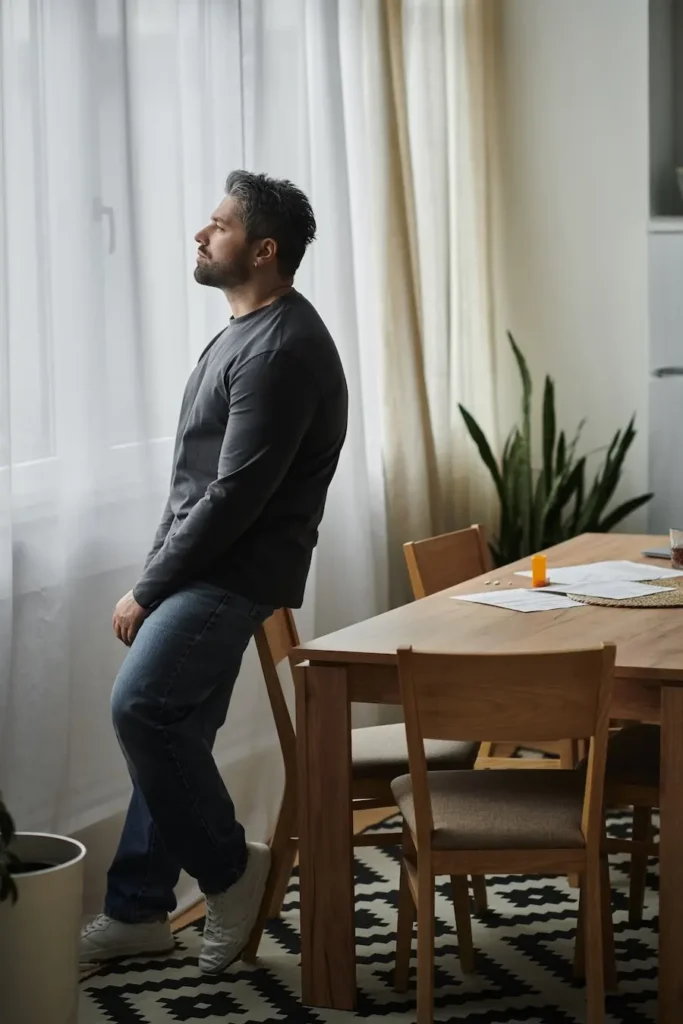 Aspen View Mental Health - man standing in room looking out window 2026 03 25 22 39 37 utc